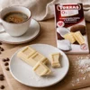 Czekolada biała z kokosem bez dodatku cukru 75g – Torras